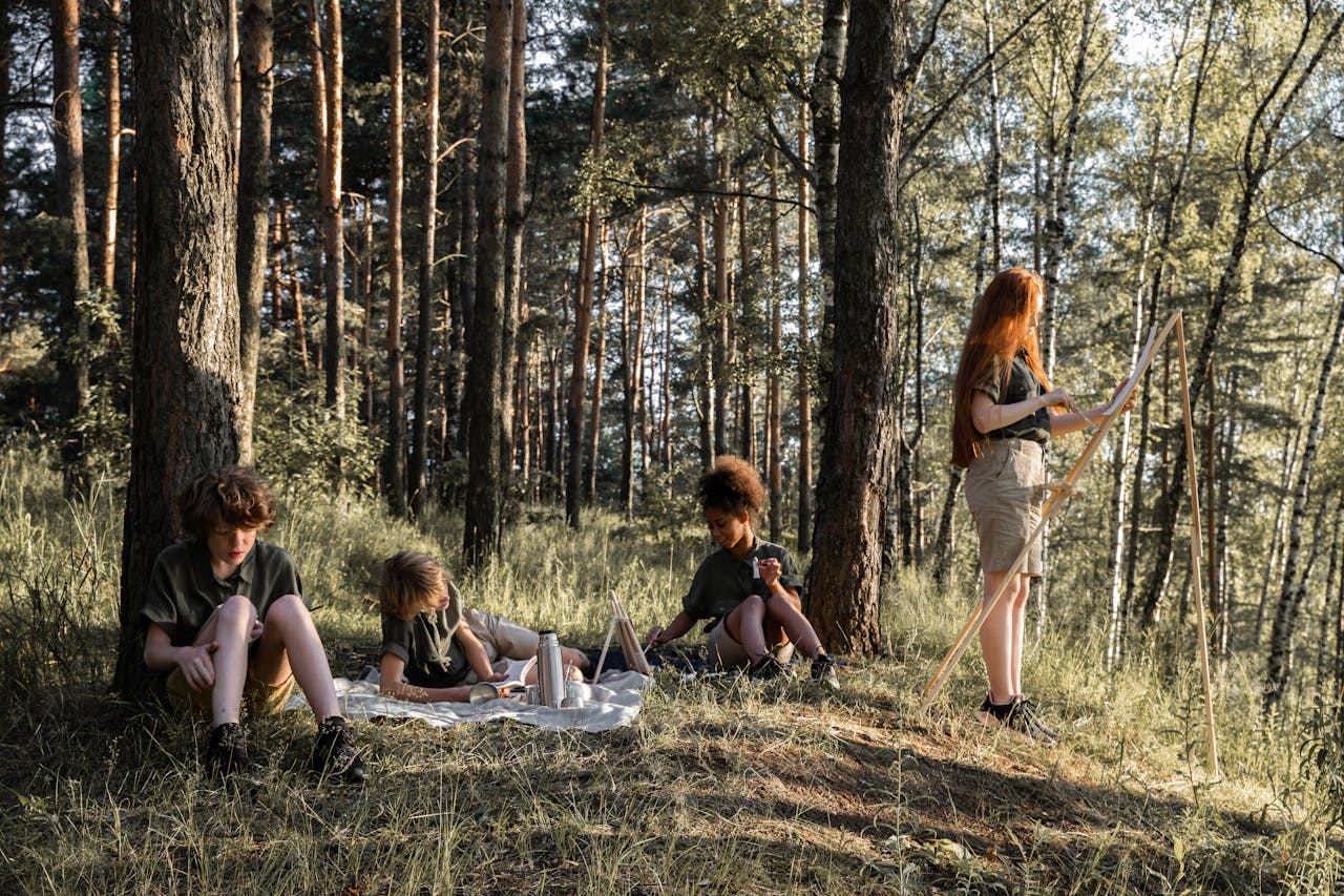 Children engaged in camping activities in a sunlit forest, enjoying nature and outdoor learning.