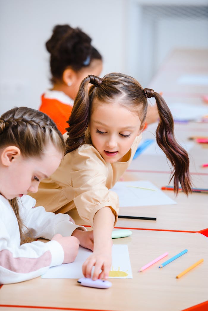Children engaged in drawing activities at school, showcasing creativity and learning.